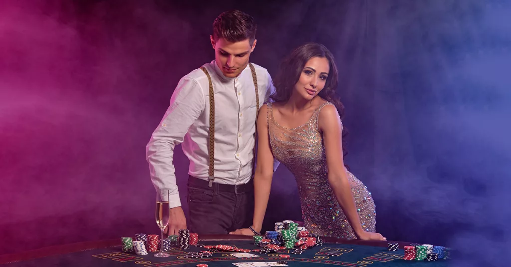 Man and a women in casino attire